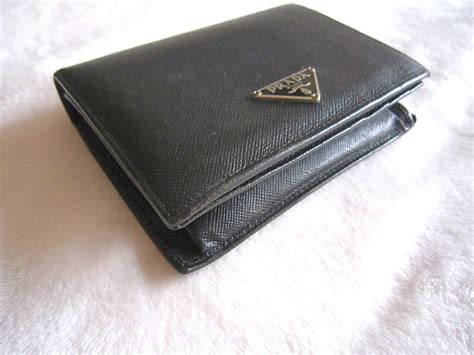 prada vs coach bifold black tab wallet